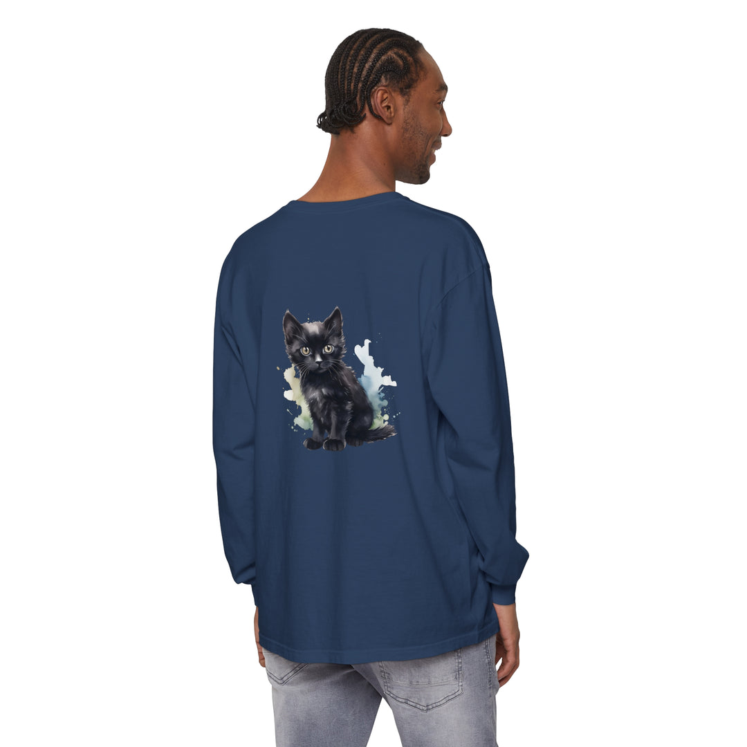 A long sleeve t-shirt featuring a watercolor illustration of a playful black kitten