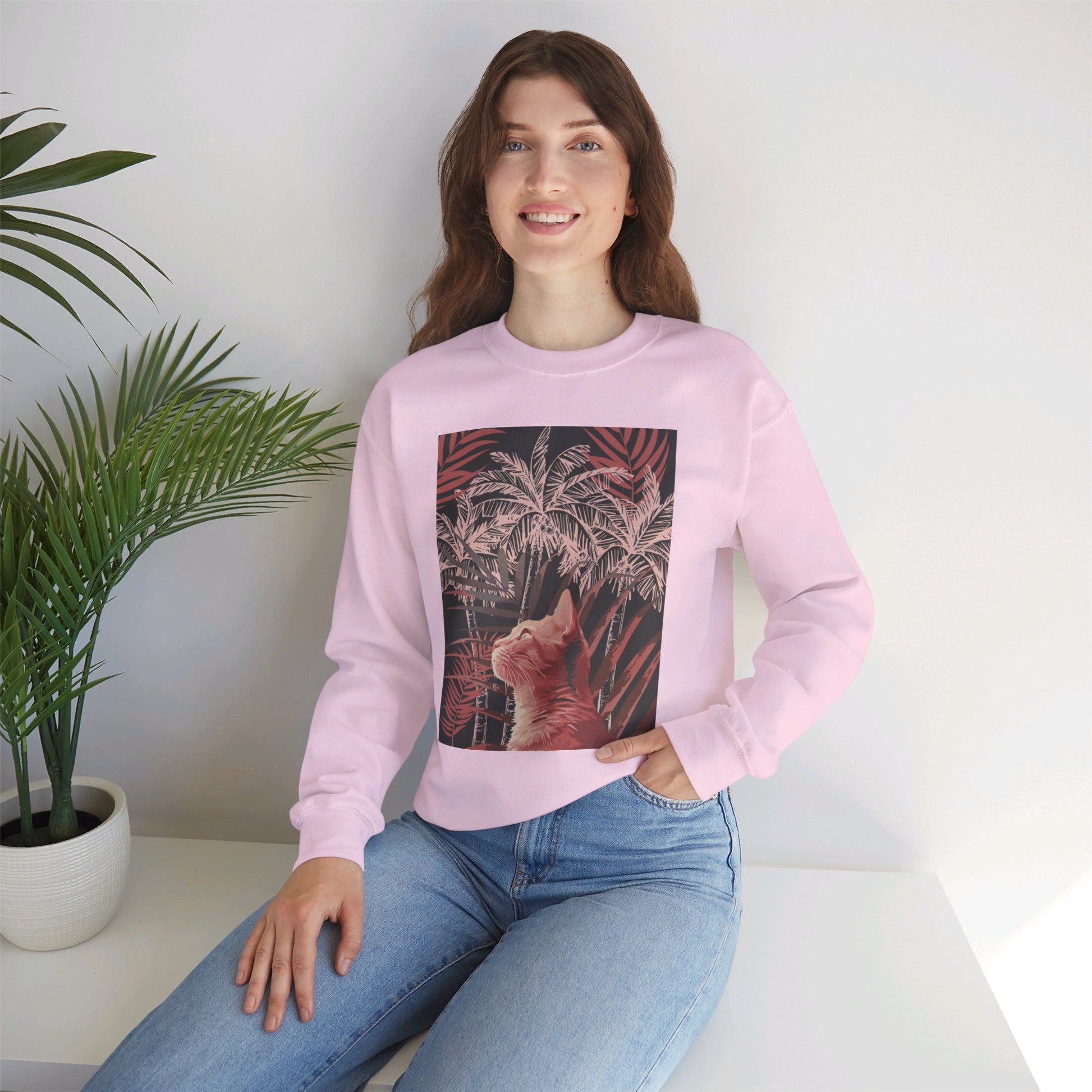 A comfortable unisex heavy blend crewneck sweatshirt featuring a cat under palm trees design