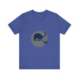 A black cat with glowing yellow eyes and a mischievous expression in a playful silhouette against a moonlit background, featured on a mystery-themed t-shirt