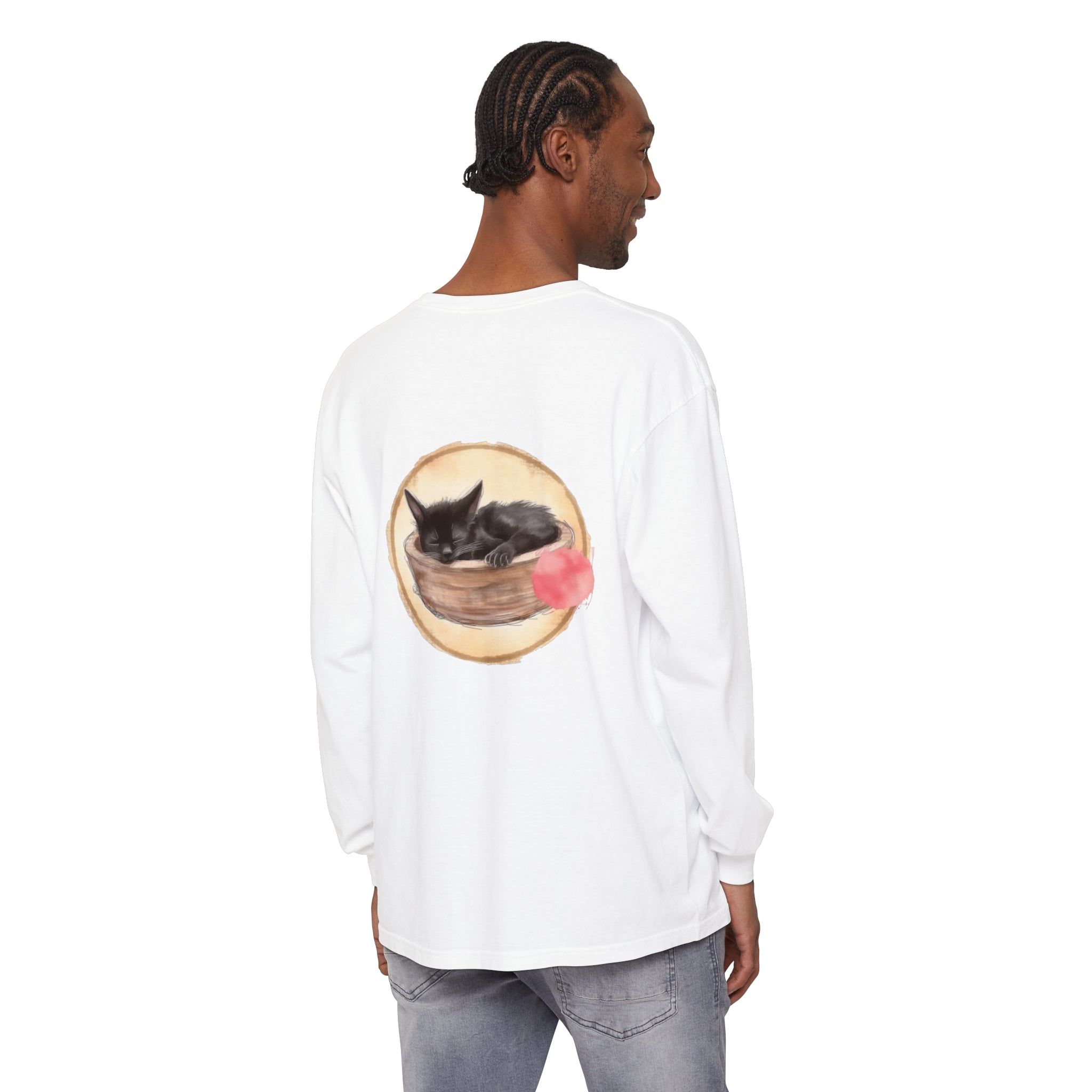 A long sleeve t-shirt featuring a watercolor illustration of a sleeping cat in a bowl