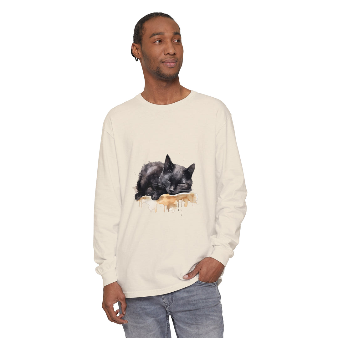 A watercolor illustration of a black cat sleeping on a t-shirt