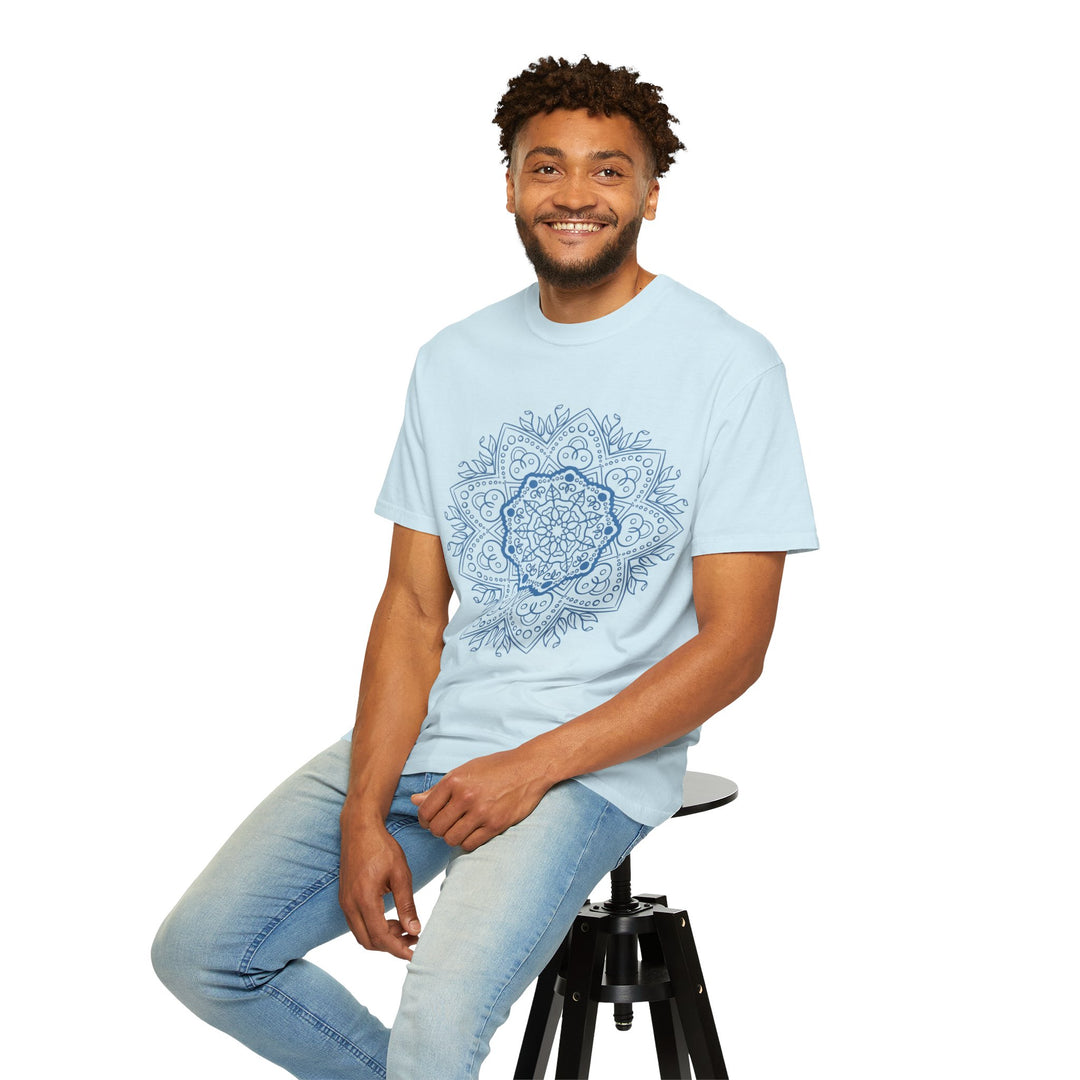 A close-up image of a vibrant, handcrafted mandala design printed on a unisex garment-dyed t-shirt