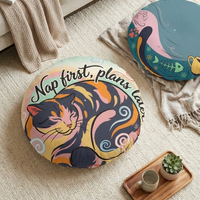 Round cat floor pillow in teal and pinks featuring a plump cat in Ukiyo-e rhythm, lifestyle setting for a cozy reading nook; close-up of flat color planes and bold lines