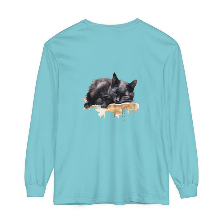 A detailed watercolor image of a black cat sleeping on a t-shirt