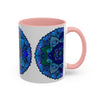 A handmade ceramic mug with a blue and purple mandala design, inspired by bohemian art