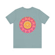 Beautiful pink and yellow mandala T-shirt with intricate design promoting peace and harmony
