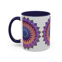 A grey ceramic mug featuring a vibrant mandala design in various colors