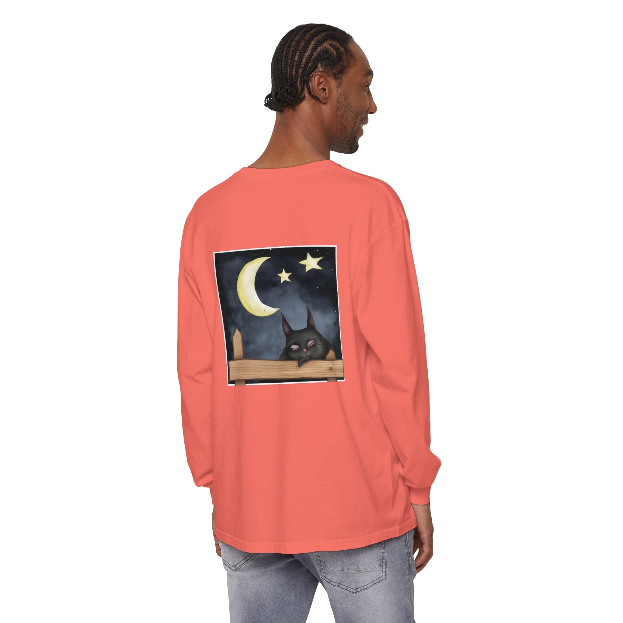 A cozy navy blue t-shirt featuring a sleeping cat against a starry night sky