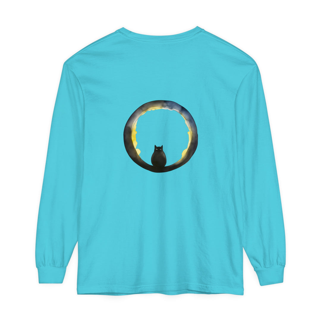 A spooky black cat with glowing eyes sits on a crescent moon against a night sky on a Halloween t-shirt