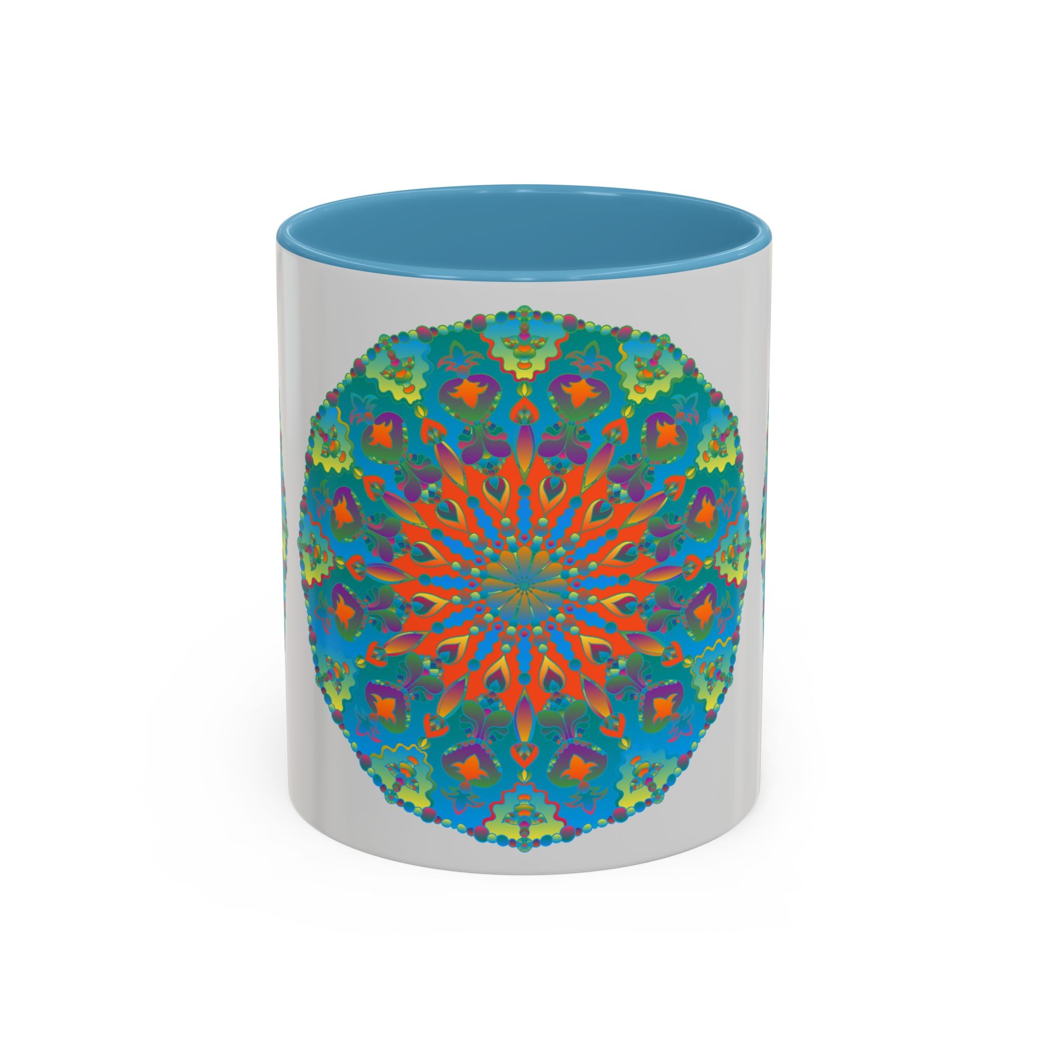 A beautiful handcrafted ceramic mug featuring an intricate mandala design in shades of blue and green