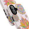 A light pink phone case with a beautiful mandala design featuring a lotus flower