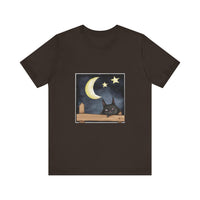 A comfortable black t-shirt with a sleepy cat design under a moonlit night