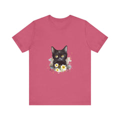 A close-up image of a black cat with piercing yellow eyes printed on a high-quality cotton t-shirt