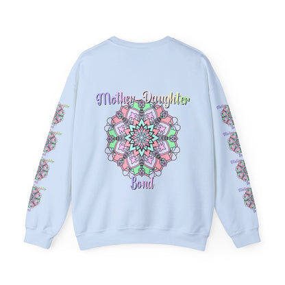 Mother and daughter embracing each other, wearing matching Mother-Daughter Bond Unisex Heavy Blend™ Crewneck Sweatshirts, the perfect birthday gift for mom