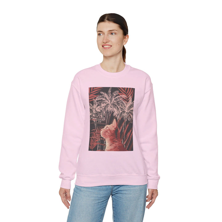 A cozy unisex heavy blend crewneck sweatshirt featuring a cat lounging under palm trees