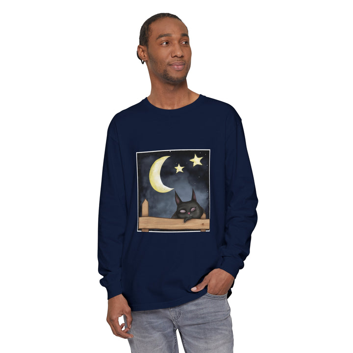 A black t-shirt featuring a sleepy cat under a starry night sky