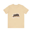 A cozy black cat curled up in a watercolor style on a t-shirt, perfect for cat lovers and sleep enthusiasts
