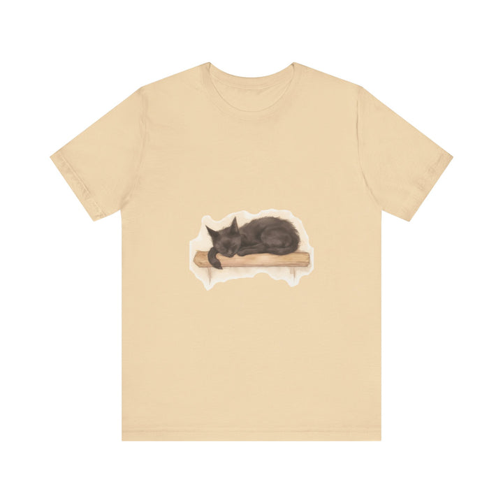 A cozy black cat curled up in a watercolor style on a t-shirt, perfect for cat lovers and sleep enthusiasts