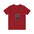 A fluffy white and grey kitten with striking blue eyes wearing a t-shirt with a cute design