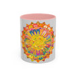A vibrant and colorful mandala design adorns a grey mug, creating a stunning and eye-catching piece of art