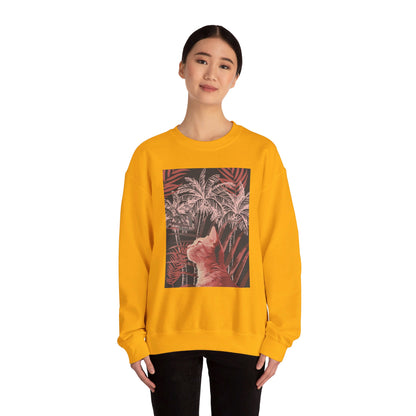 A cozy unisex heavy blend crewneck sweatshirt featuring a cat resting under palm trees