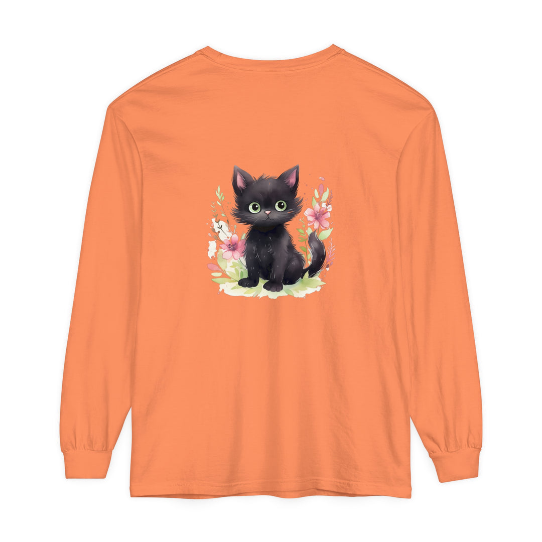 Adorable and playful kitten surrounded by vibrant floral watercolor print on a t-shirt