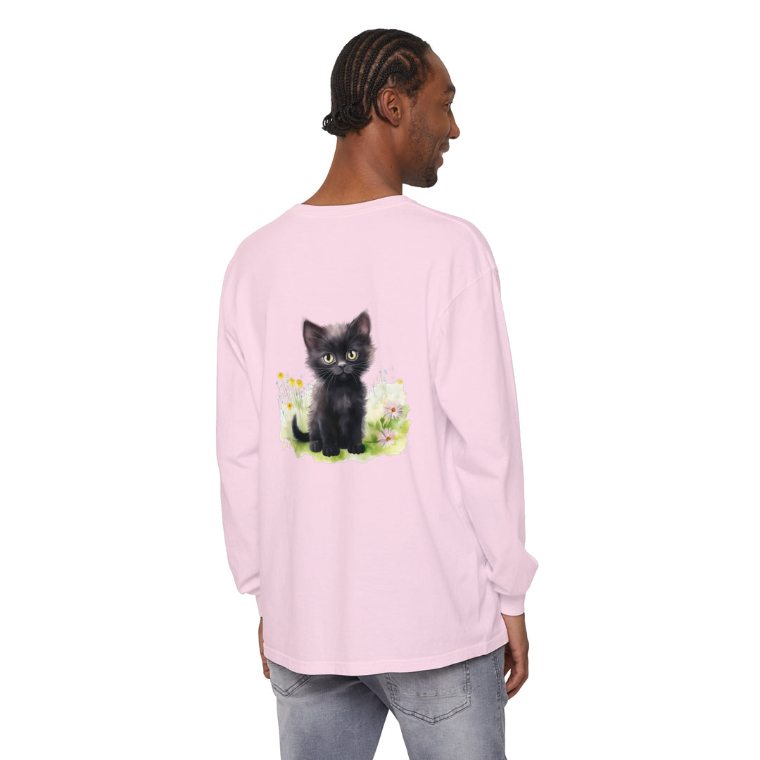 Adorable black kitten sitting in a vibrant flower garden printed on a long sleeve t-shirt