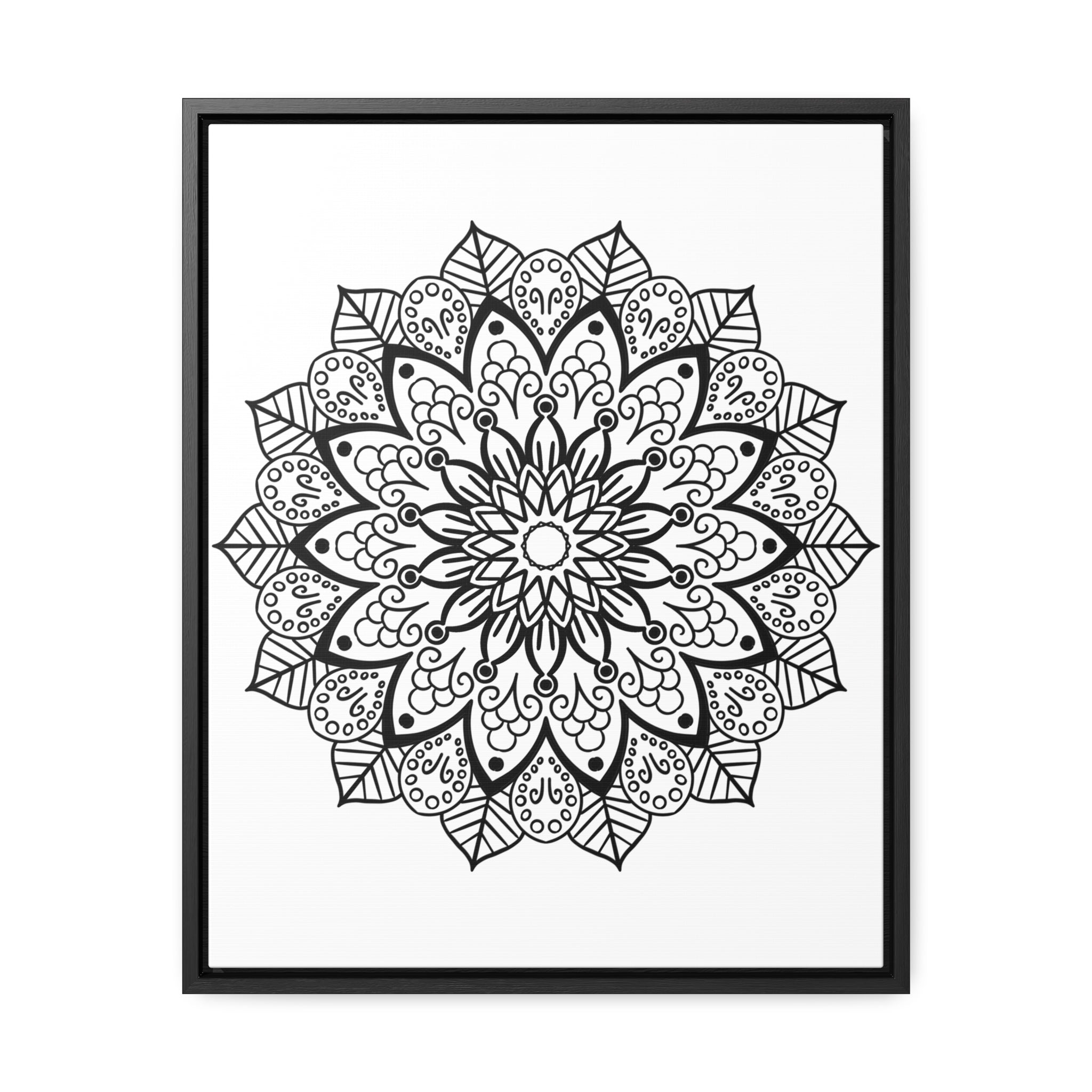 A detailed close-up of a handcrafted black and white mandala art piece on a gallery canvas wrap, displayed in a vertical frame