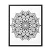 A detailed close-up of a handcrafted black and white mandala art piece on a gallery canvas wrap, displayed in a vertical frame