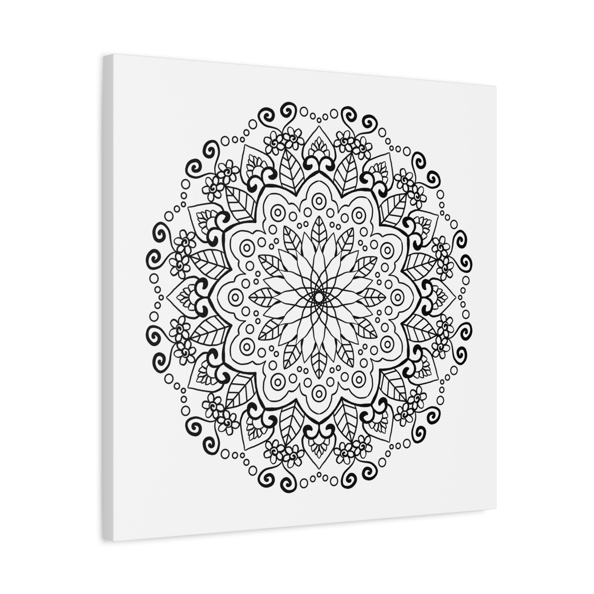 Handmade mandala art featuring intricate black and white designs on matte canvas, stretched and ready to hang on your wall