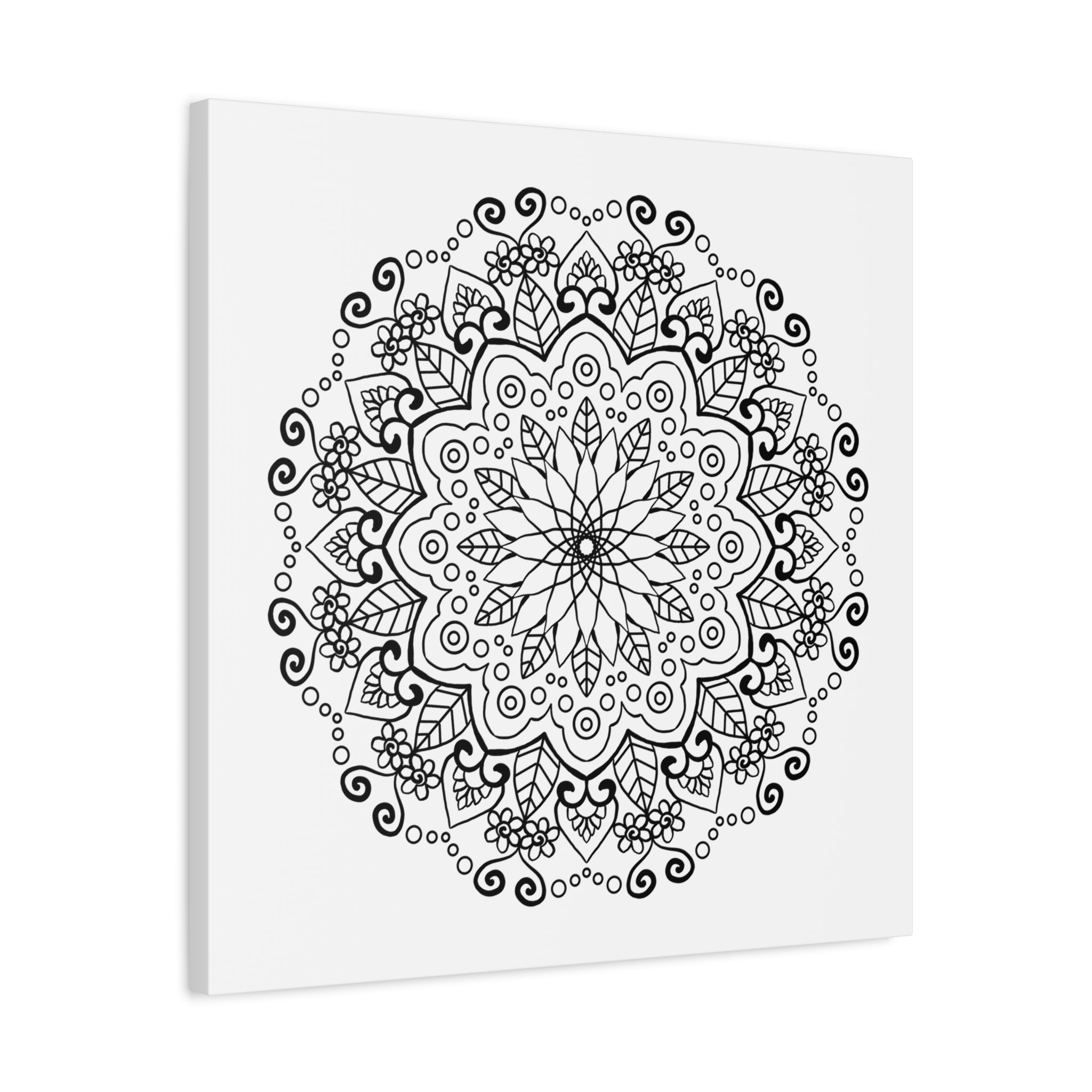 Handmade mandala art featuring intricate black and white designs on matte canvas, stretched and ready to hang on your wall