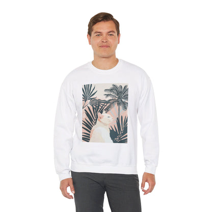 A cozy unisex heavy blend crewneck sweatshirt featuring a cat relaxing under palm trees