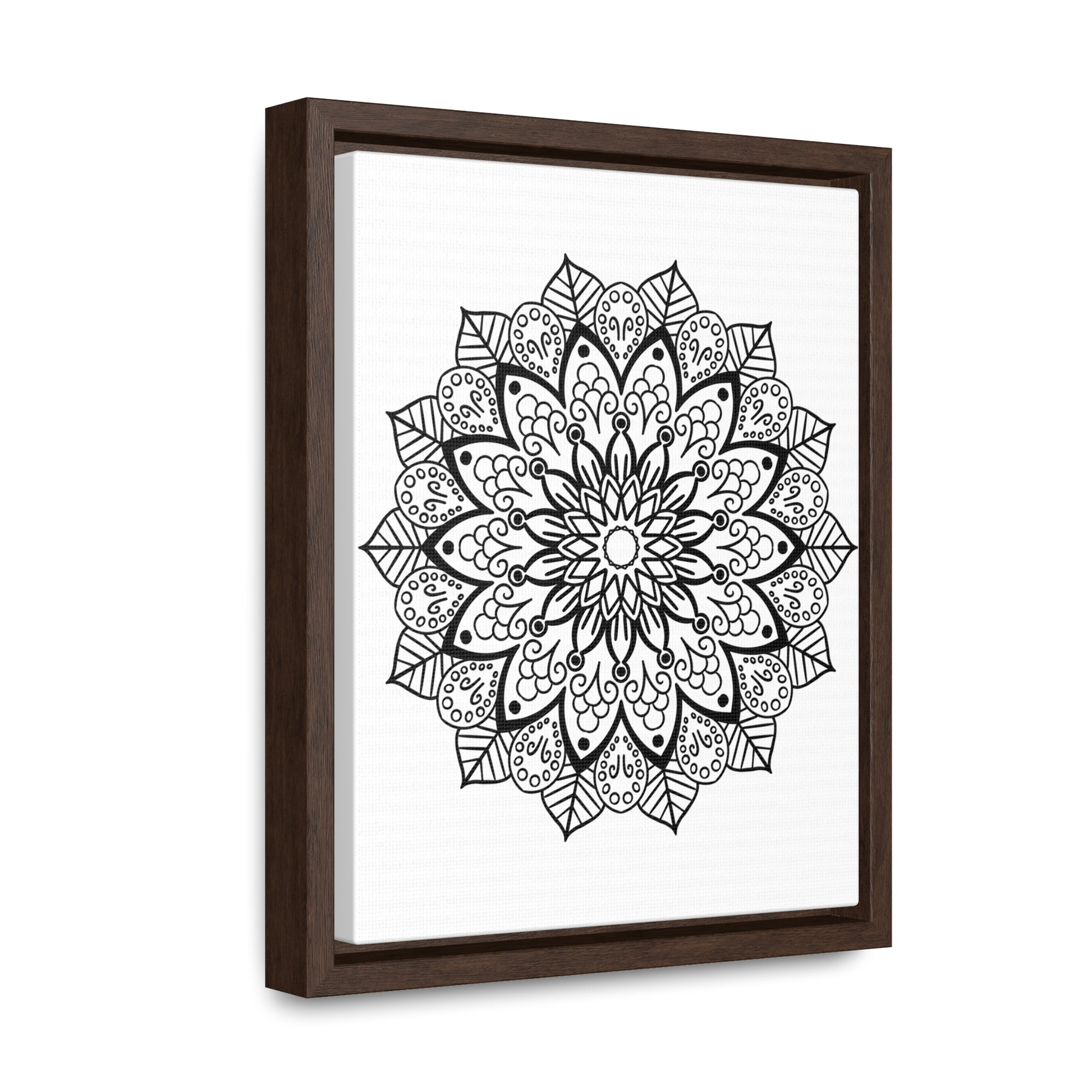 Handmade black and white mandala art on canvas wraps, perfect for vertical framing in a gallery setting