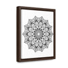 Handmade black and white mandala art on canvas wraps, perfect for vertical framing in a gallery setting