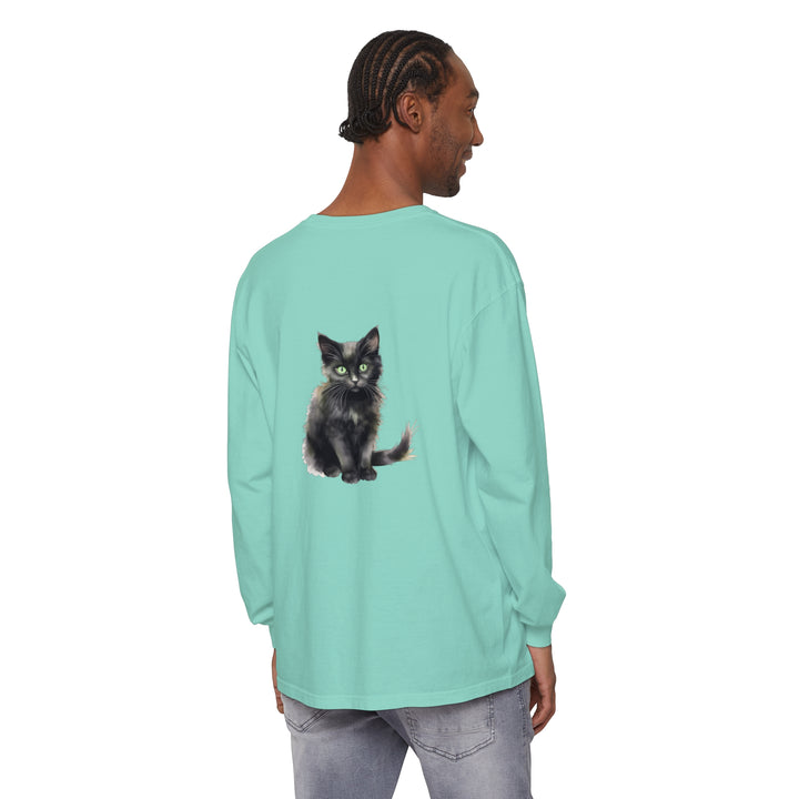 A striking watercolor illustration of a black cat with piercing green eyes on a t-shirt