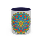 Handcrafted ceramic mug featuring a vibrant mandala art design in yellow, orange, and blue colors