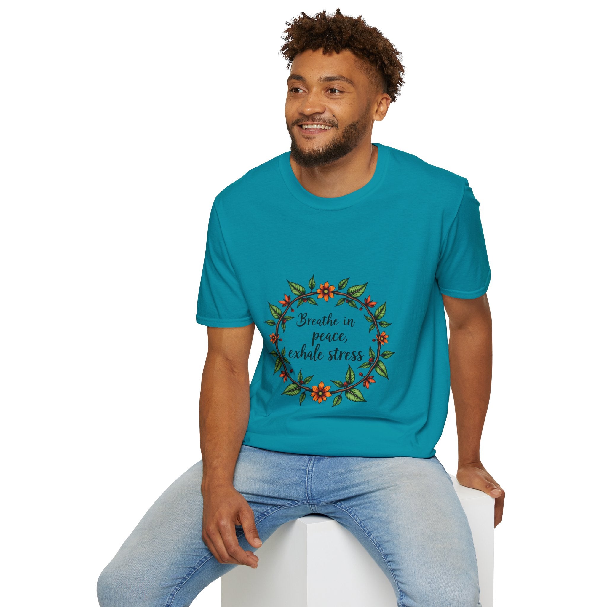 Beautiful t-shirt with a floral garland design and the slogan 'Breathe in Peace Exhale Stress' in a calming and soothing color palette