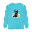 A black kitten sitting in a colorful flower garden, printed on a long sleeve t-shirt