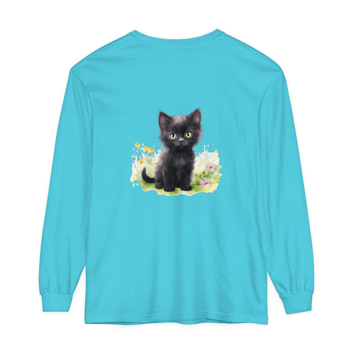 A black kitten sitting in a colorful flower garden, printed on a long sleeve t-shirt