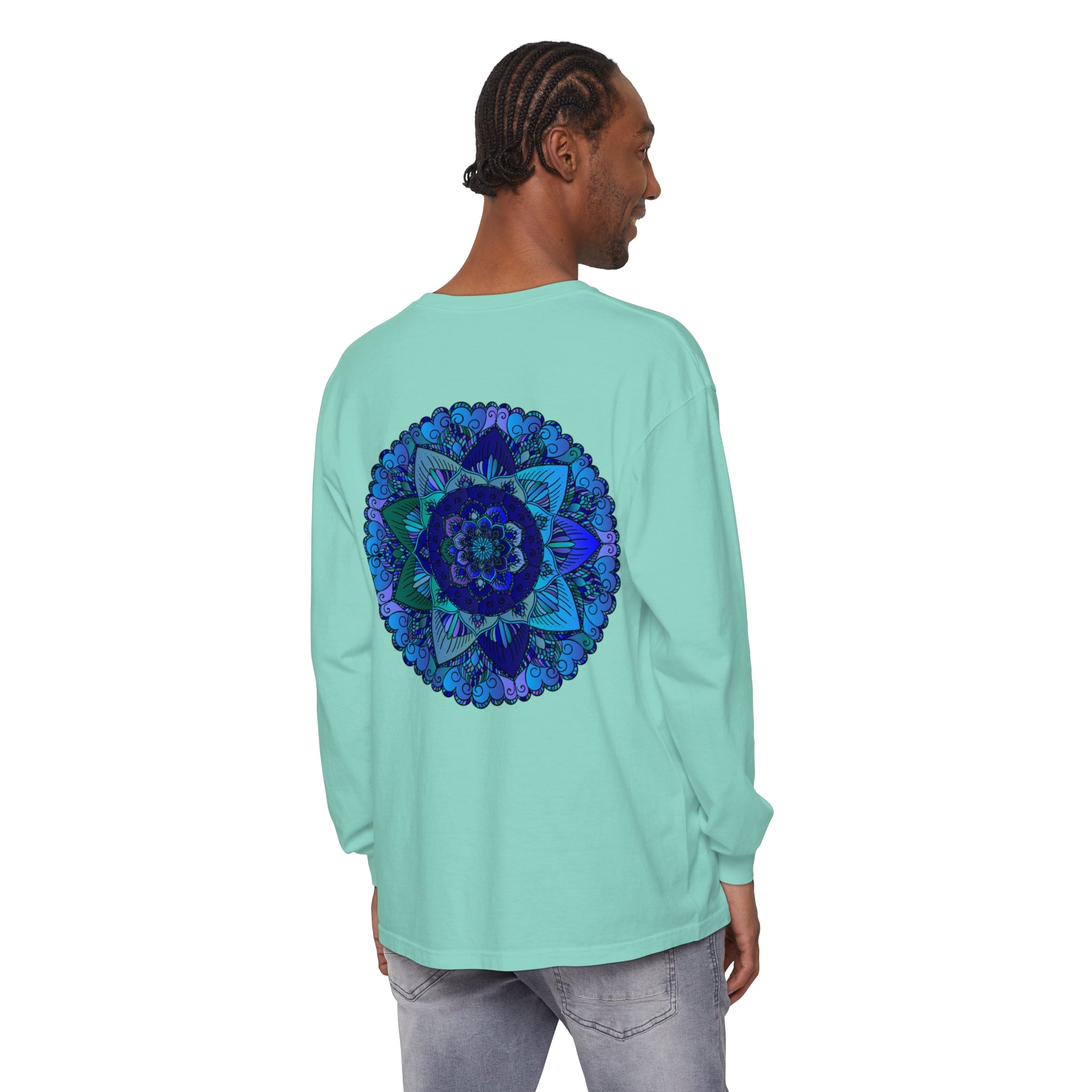 A close-up image of a dark blue and green mandala long sleeve t-shirt with intricate, ornate design