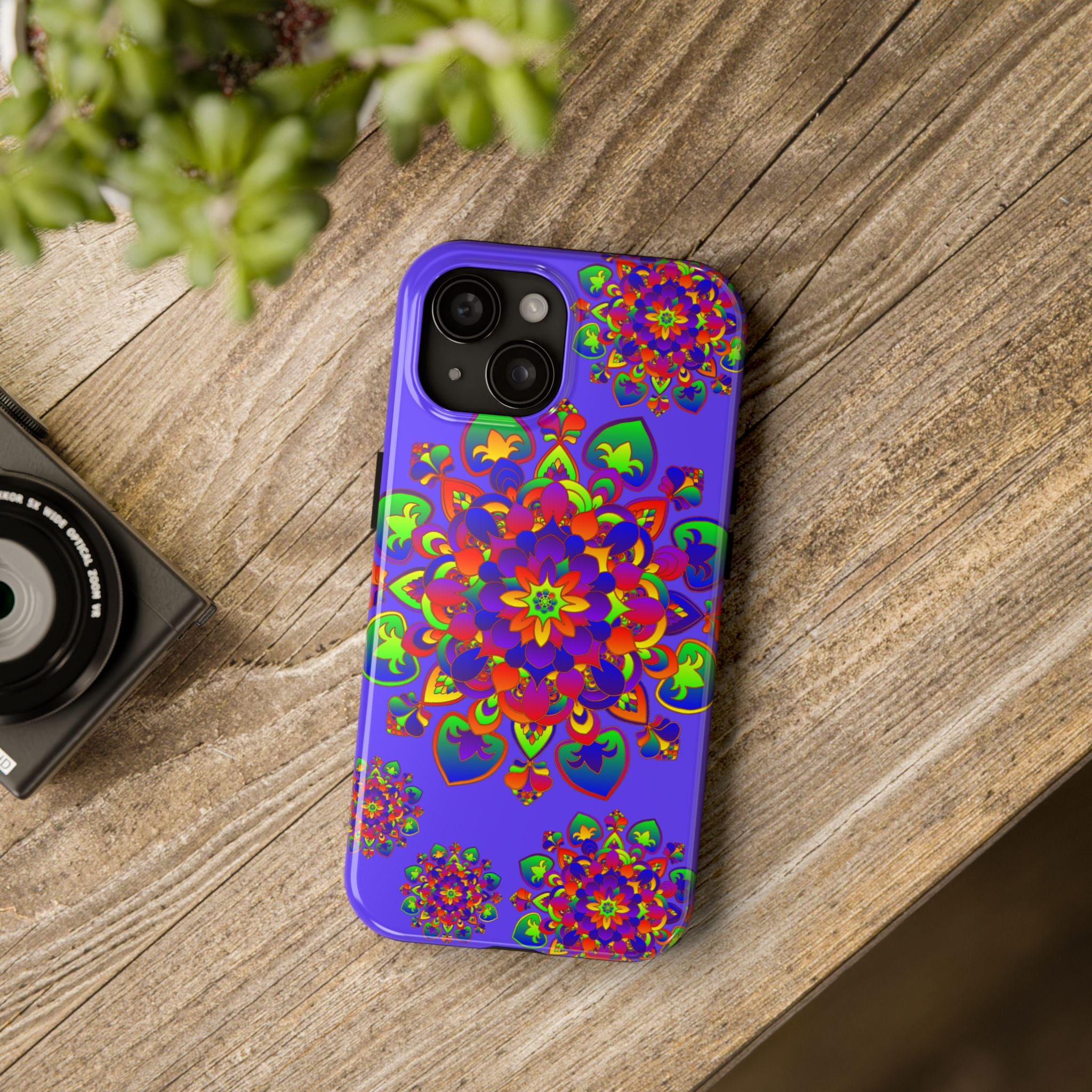 Colorful hand drawn mandala phone case with rainbow design on black background