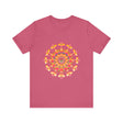 Vibrant mandala tee in shades of pink, yellow, orange, and green with intricate design