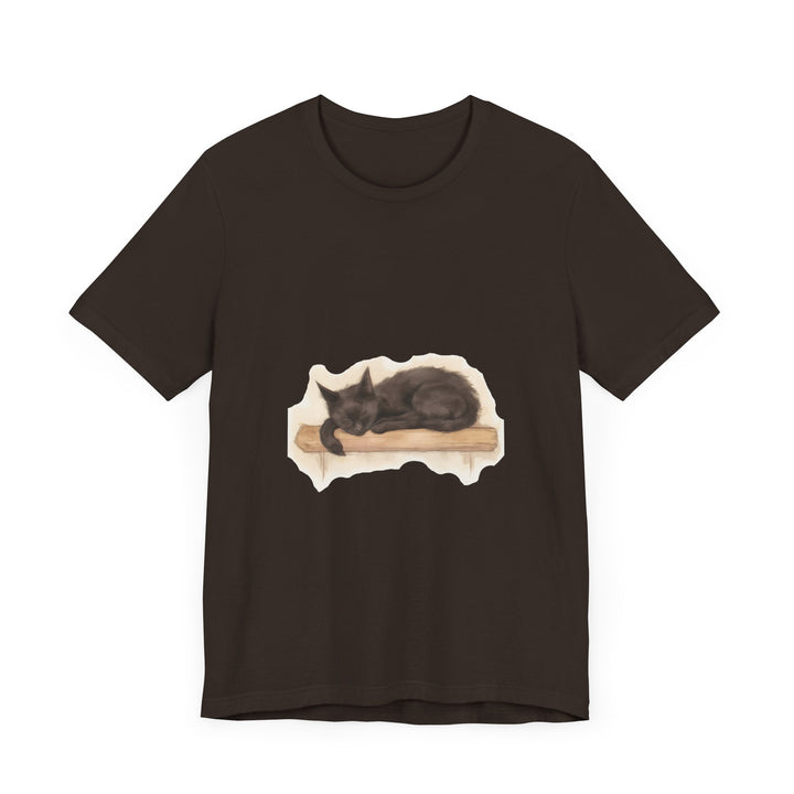 A whimsical watercolor illustration of a black cat peacefully sleeping on a t-shirt