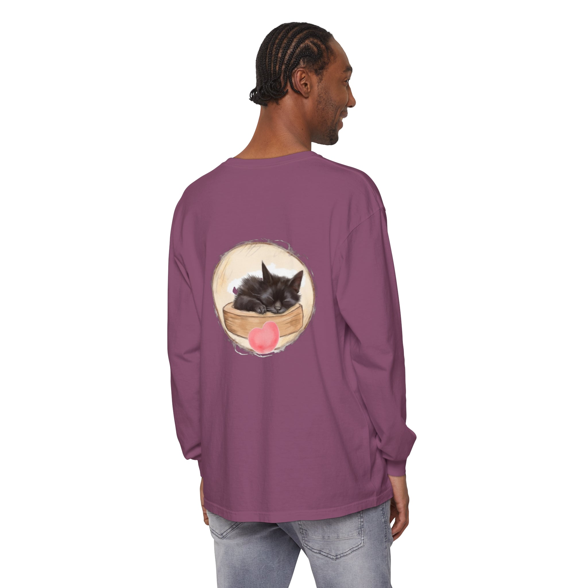 A cute, black unisex t-shirt featuring an adorable sleeping kitten design