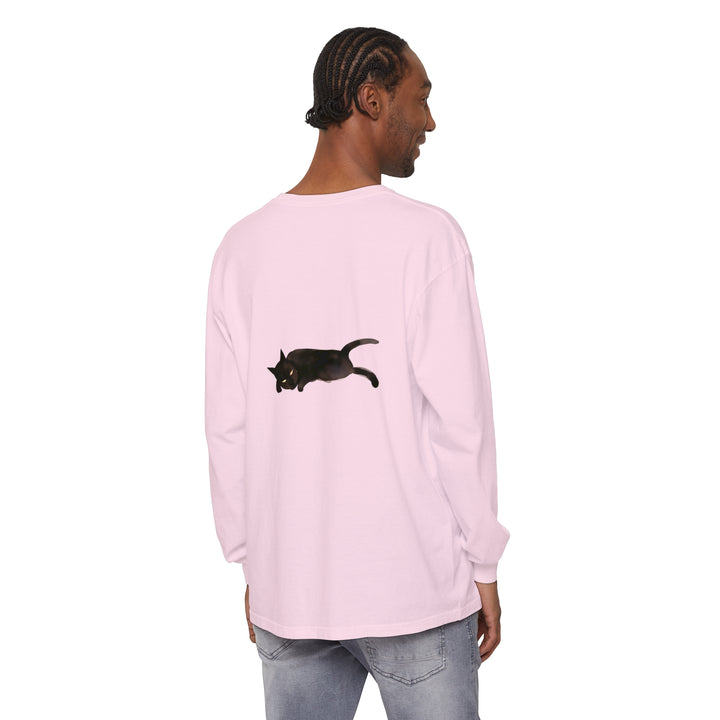 A black cat with yellow eyes sleeping on a unisex long sleeve t-shirt