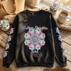 Black sweatshirt with 'Mother-Daughter Bond' design on a wooden surface with decor items.