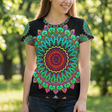 Lifestyle shot of a mandala art t-shirt in bold green and red being worn, showing everyday wearability and comfortable fit.