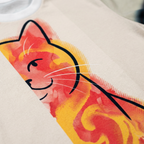 Black t-shirt featuring a double-exposure sarcastic cat illustration in a lifestyle studio setting; the design combines an aloof cat silhouette with a chaotic scribble, using a palette that includes #0D1B2A, #FF6B6B, #FFD166, #4D96FF, #FFFFFF, #1A936F