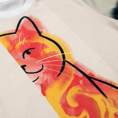 Black t-shirt featuring a double-exposure sarcastic cat illustration in a lifestyle studio setting; the design combines an aloof cat silhouette with a chaotic scribble, using a palette that includes #0D1B2A, #FF6B6B, #FFD166, #4D96FF, #FFFFFF, #1A936F