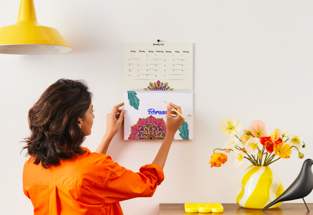 Flat lay of 2025 calendar with holidays printable surrounded by colorful markers